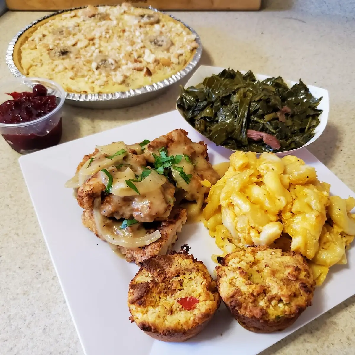 Turkey Chops Cornbread Dressing Collard Greens Mac and Cheese with Banana Pudding Cheesecake