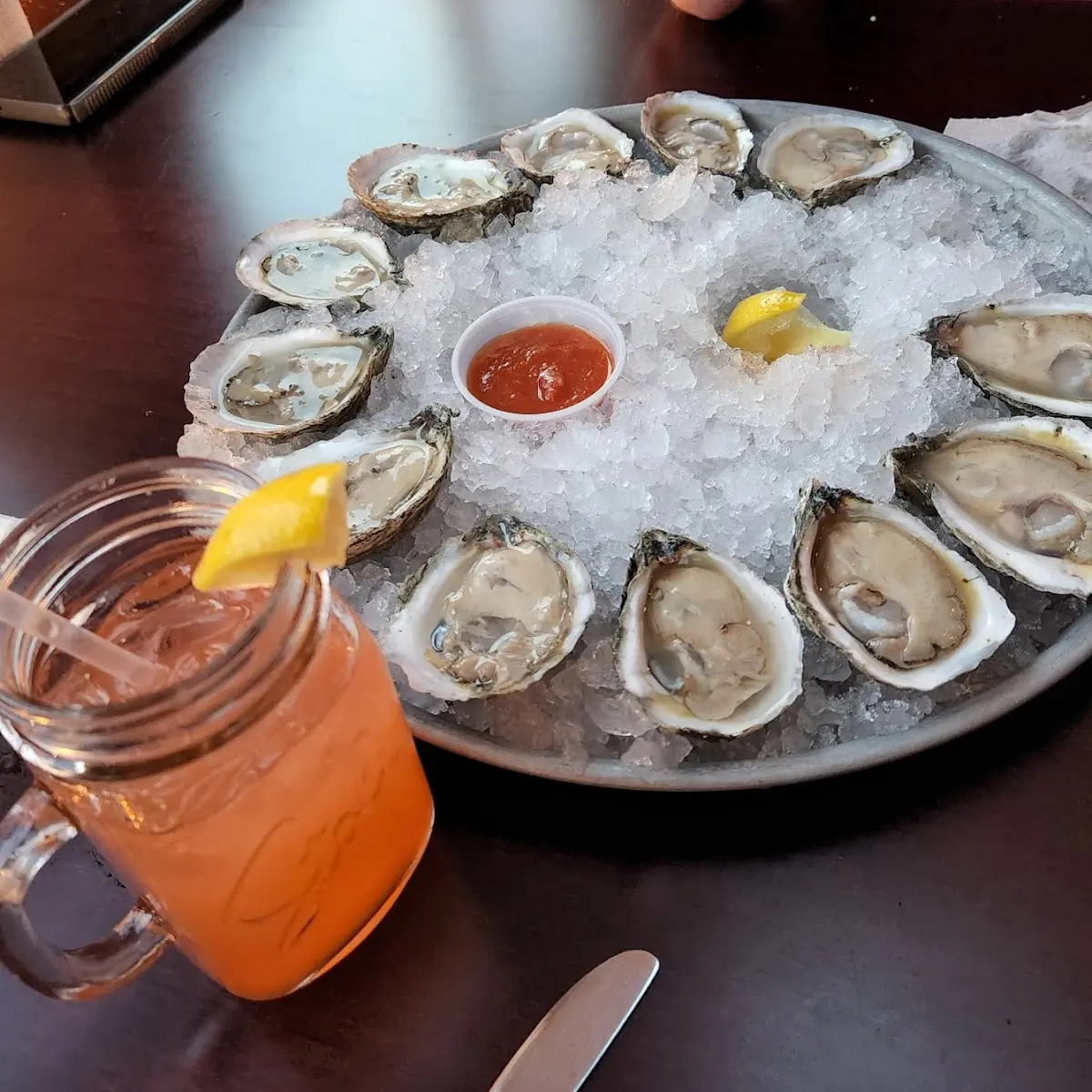 A Dozen Raw Oysters and Oysters Romano