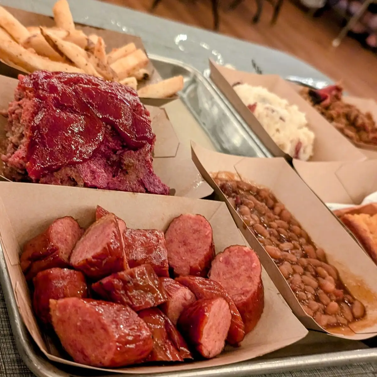 Pick Three Brisket Pulled Pork and Pulled Chicken with Garlic Mashed Potatoes and Corn Bread