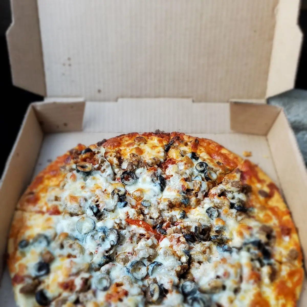 Meat Lovers Pizza with Black Olives and Onions