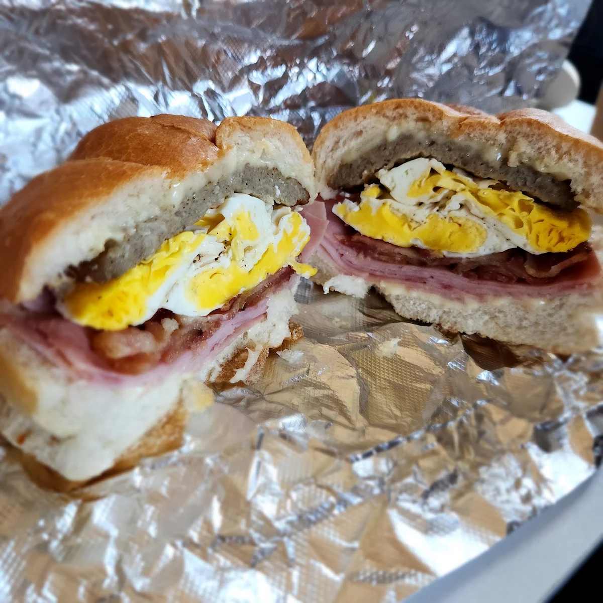 Sausage Ham Bacon Egg and Cheese on Hard Roll