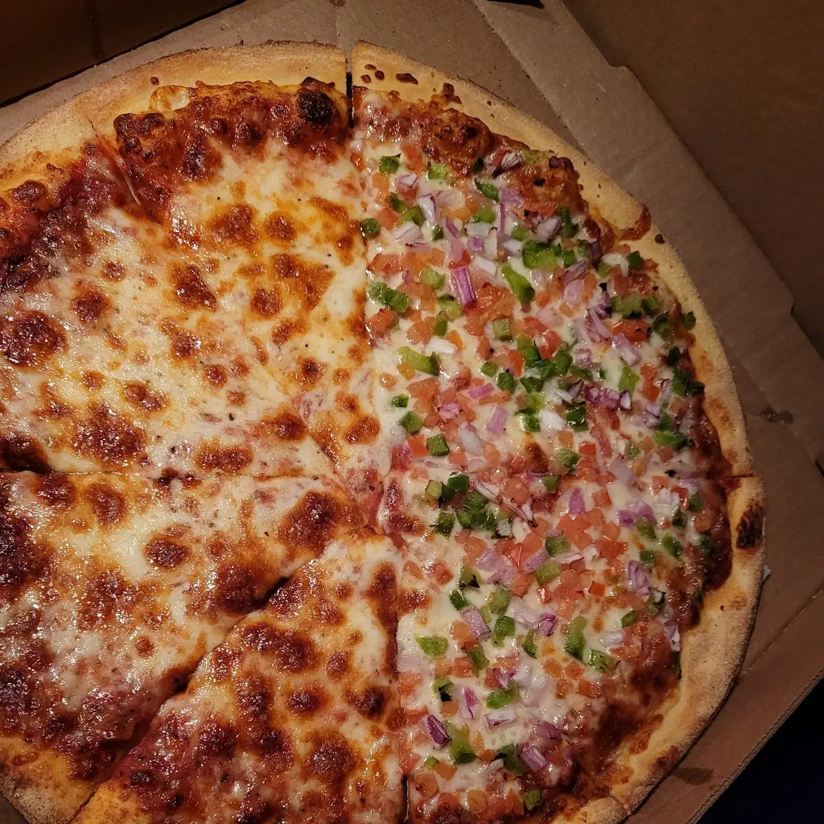 Half Veggie Pizza and Half Cheese