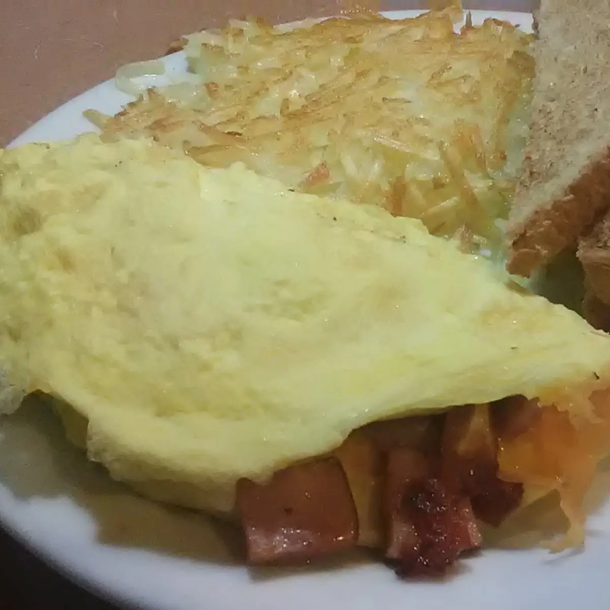 Scrambled Eggs Hash Browns and Bacon