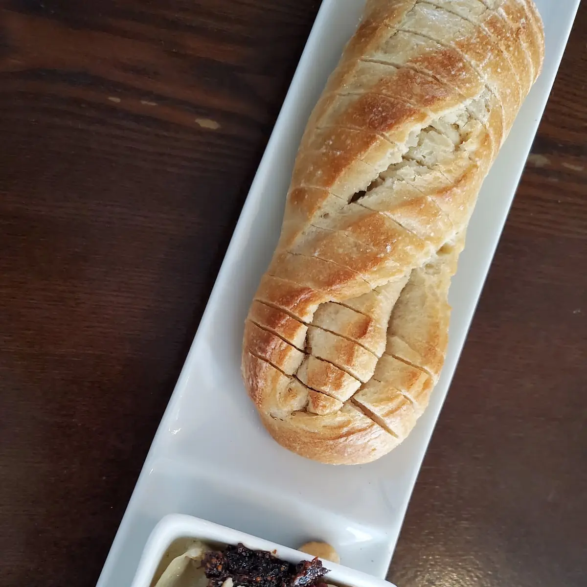 Baked Brie with Fig Jam Hazelnuts & Cranberries Served with Warm Baguette