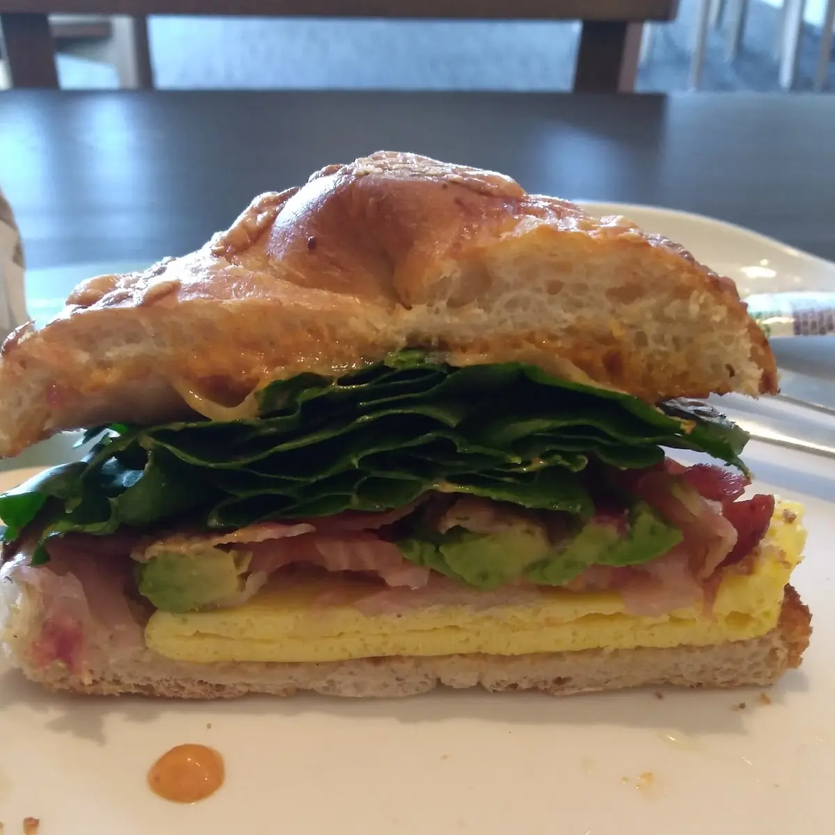 Scrambled Egg with Cheese Bacon Spinach Pickle Onion Tomato Avocado Wit Special Sauce Asiago Bagel