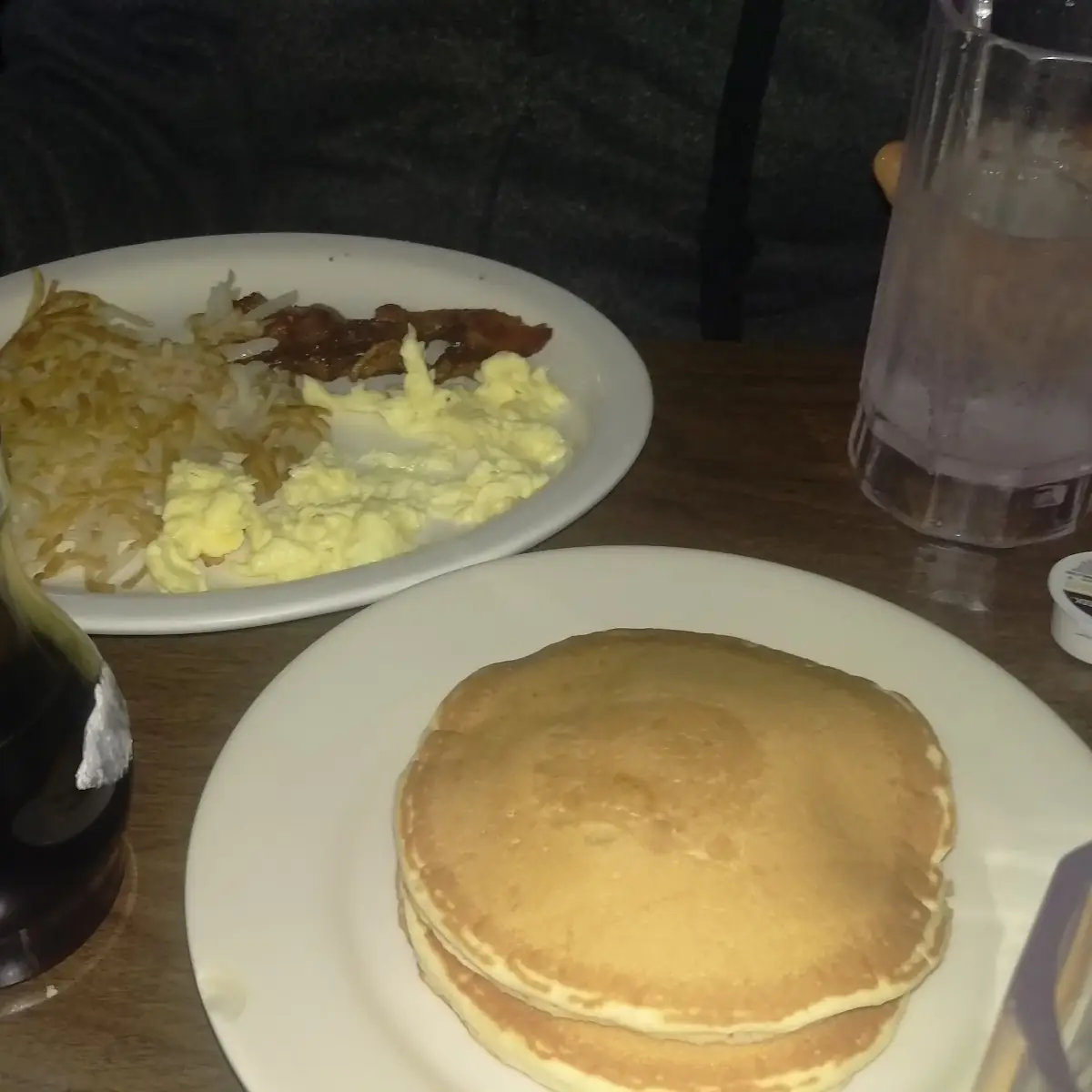 Scrambled Eggs with Hash Browns and Bacon Plus Pancakes
