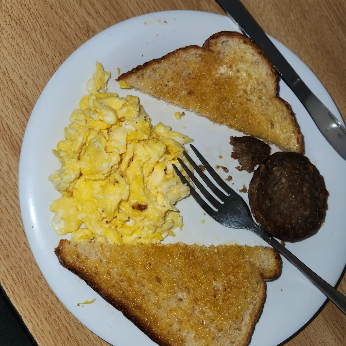 Lightly Scrambled Eggs with White Toast and a Sausage