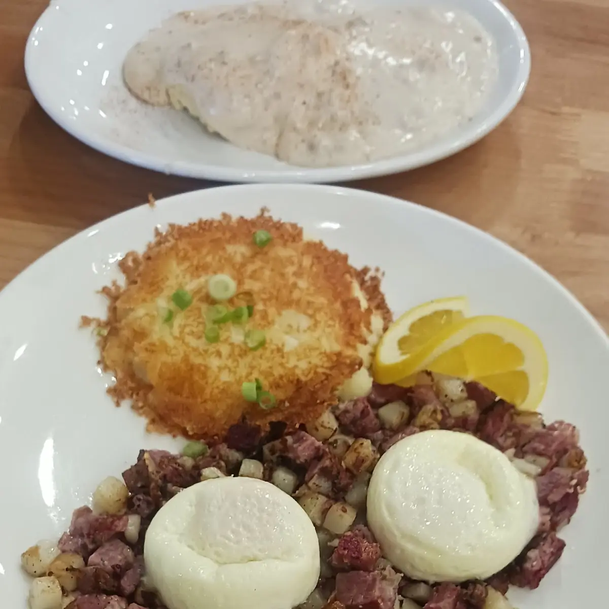 Corned Beef Hash with Grilled Mash Potatoes Poached Eggs Easy with Biscuits and Gravy
