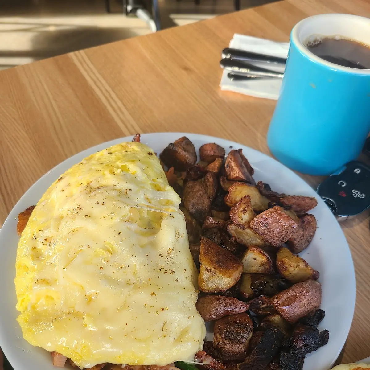 Meat Lovers Omelet with Country Potatoes