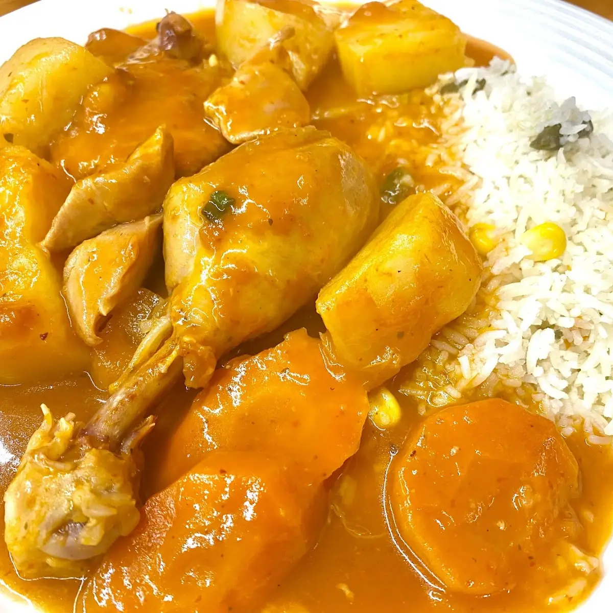 Chicken Stew with Carrots and Potatoes Served with Rice and Homemade Corn Tortillas