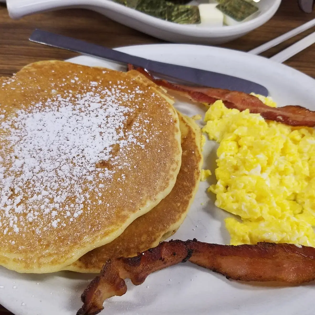 Scrambled Eggs 3 Strips of Crispy Bacon & 2 Pancakes