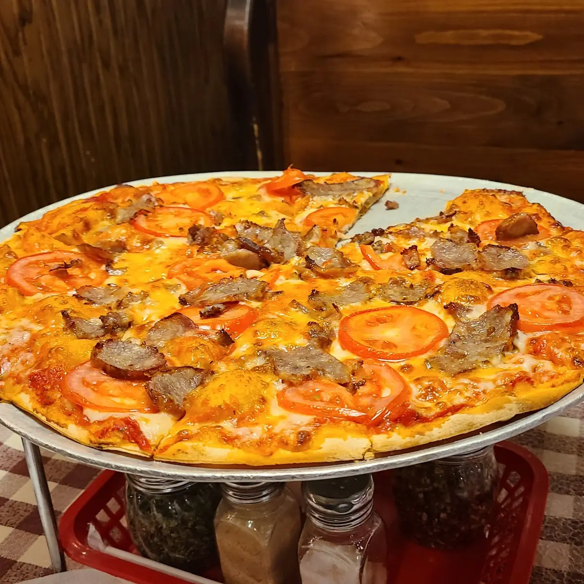 Large Sausage Pizza with Sliced Tomatoes