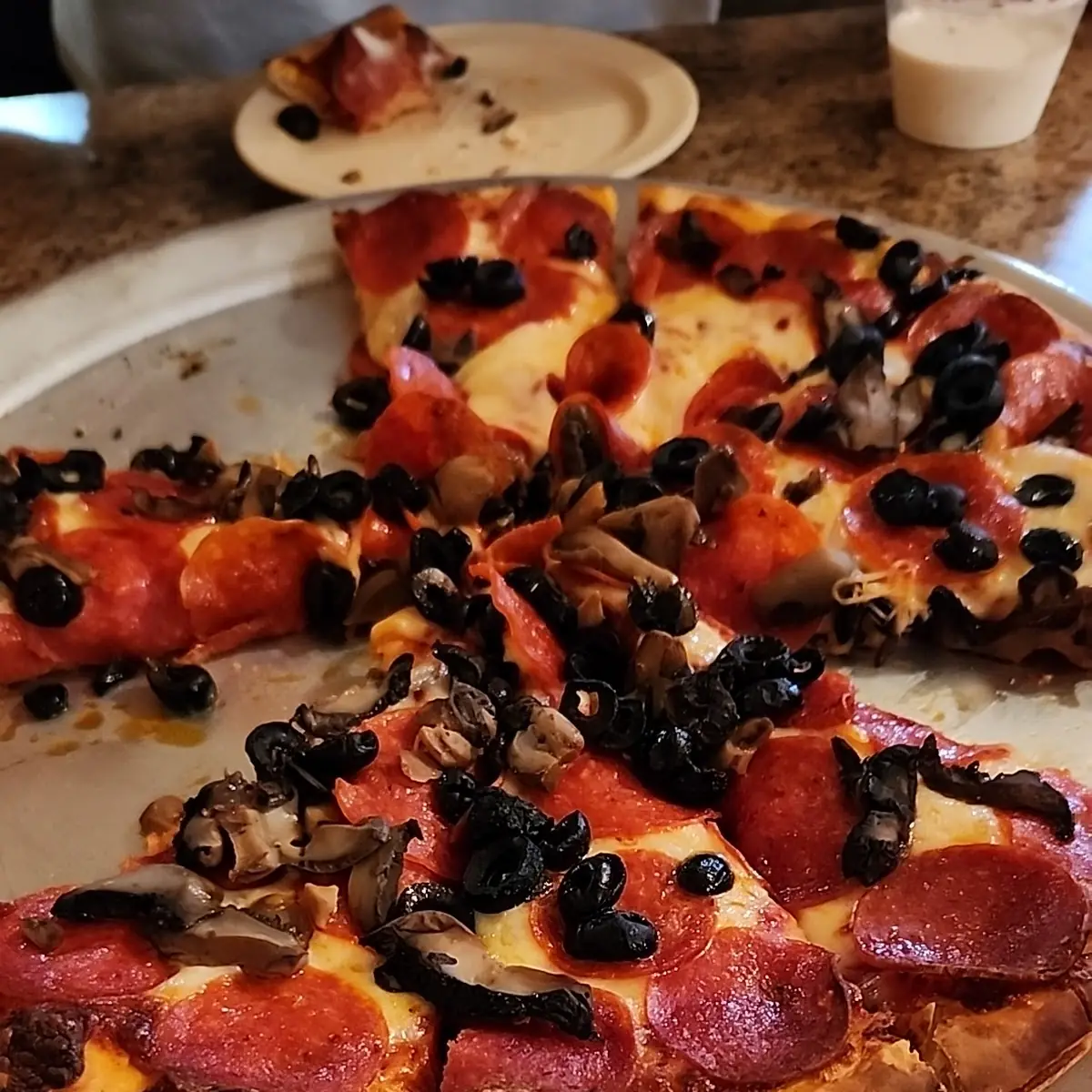 Thin Crust Pepperoni Black Olive & Mushroom Pizza