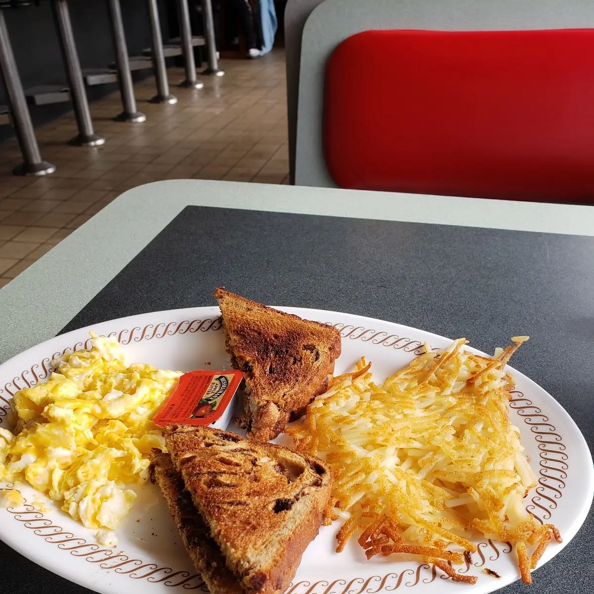 Scrambled Eggs and Toast and Jam with Hash Brown Potatoes