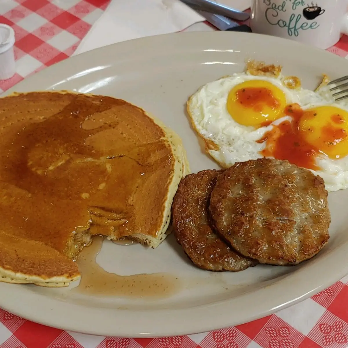 Two Pancakes Two Eggs and Bacon or Sausage