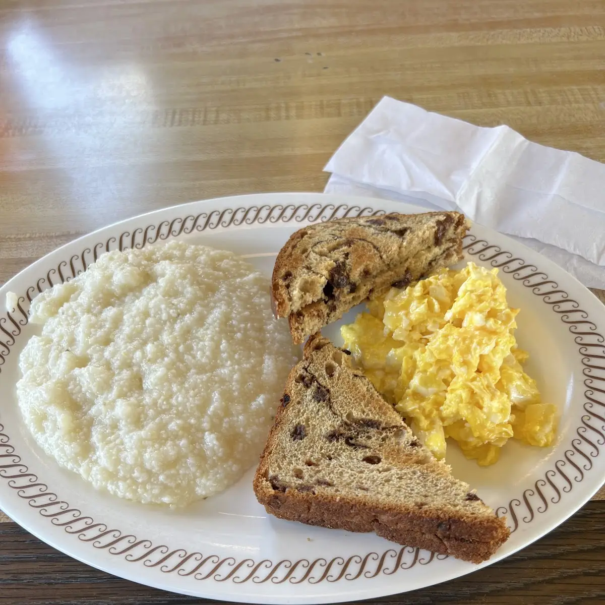 2 Scrambled Eggs Grits and Raisin Toast