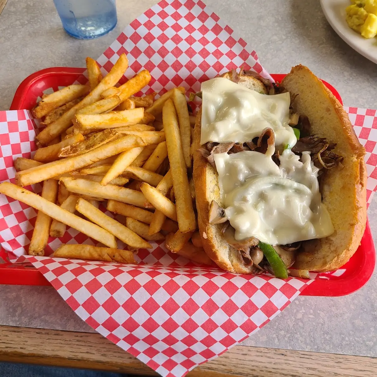 Philly Cheese Steak Sandwich and Fries