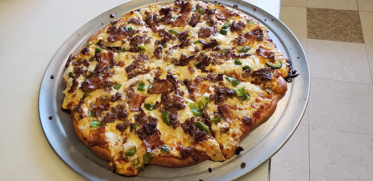 Steak Bacon Onions and Peppers Pizza