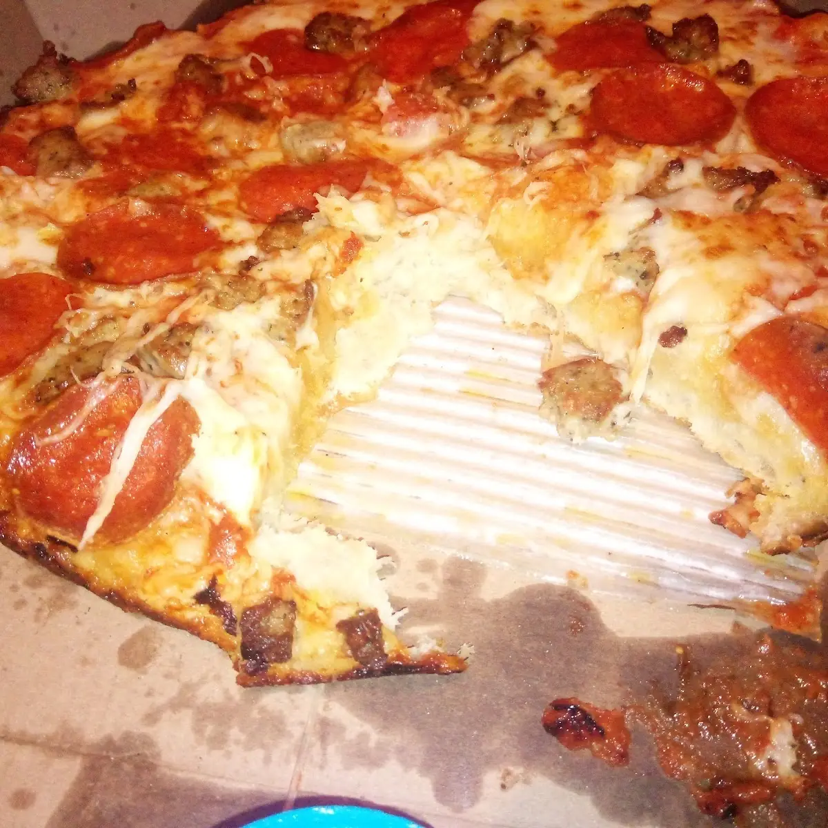Pepperoni and Sausage Pizza not Cut Properly