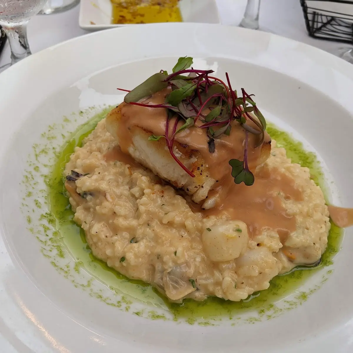 Pan Seared Atlantic Halibut over Seafood Risotto with Lobster Cream Sauce