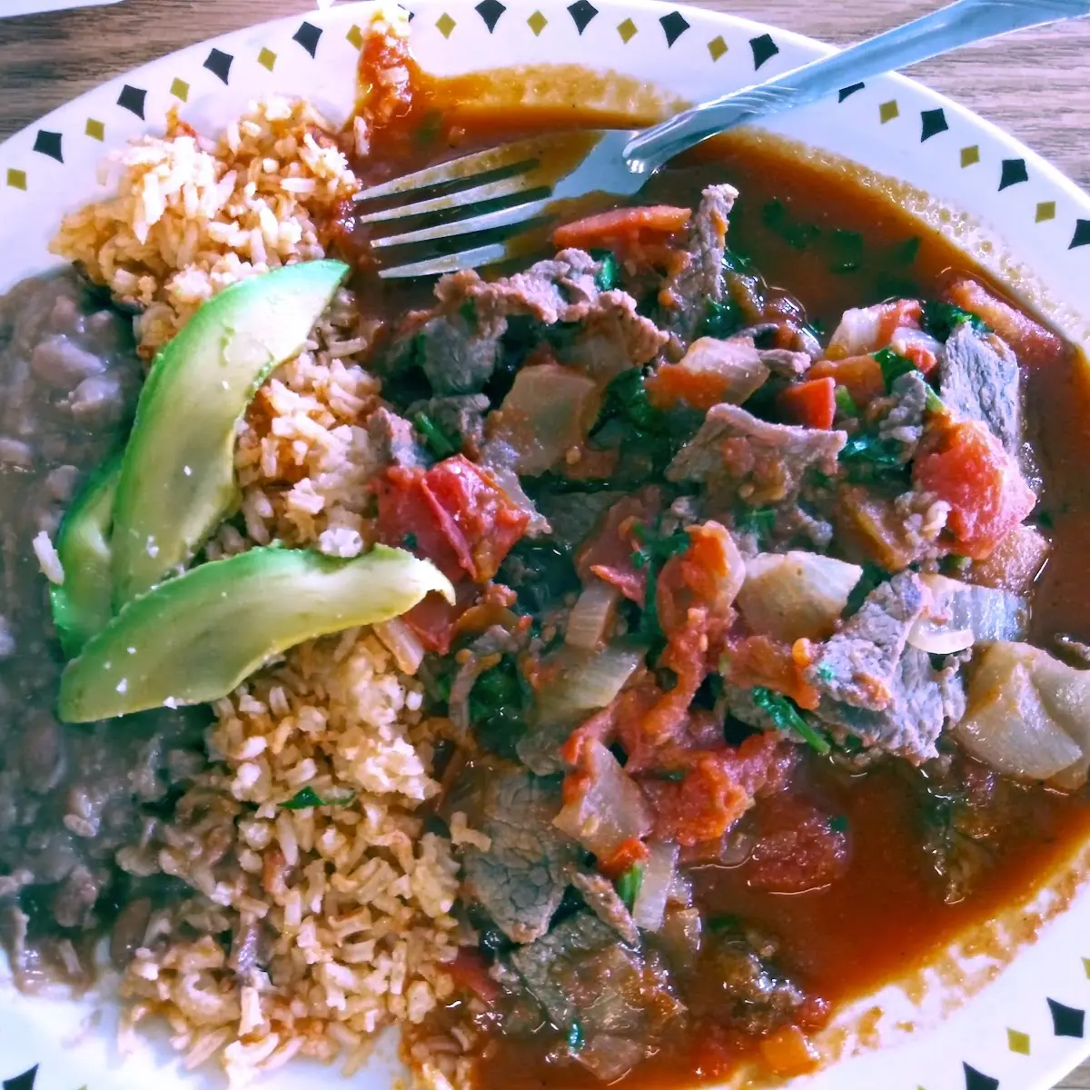 Bistec Ranchero with Rice Beans Avocado and Tortillas