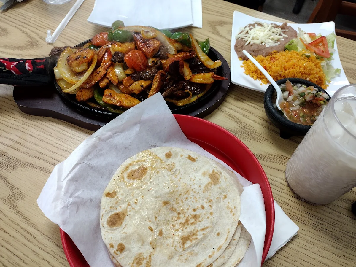 Steak Chicken and Shrimp Fajitas