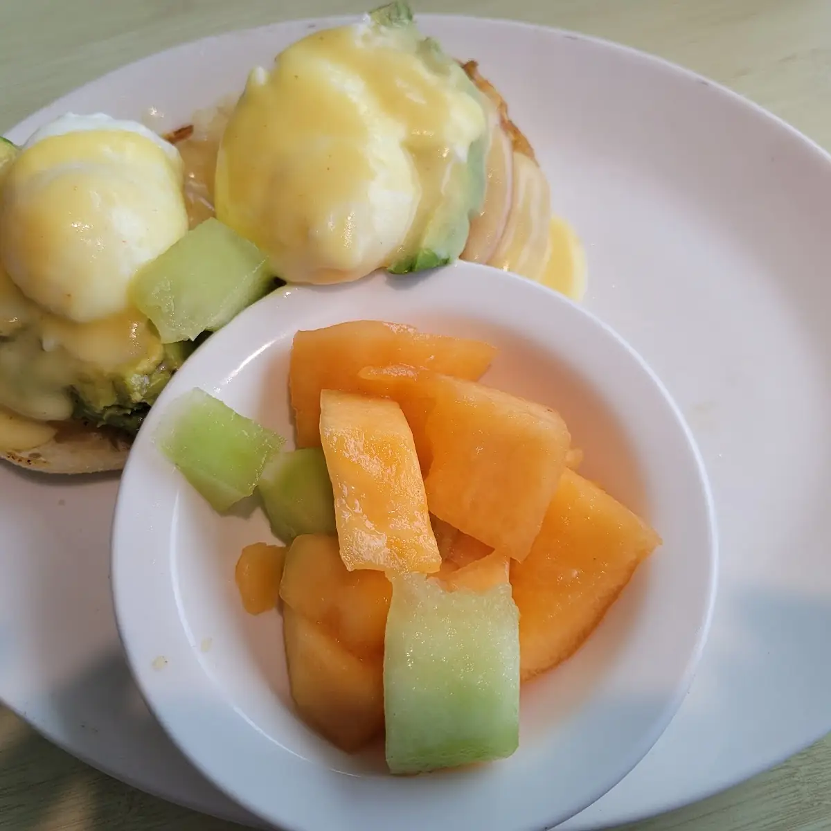 Eggs Benedict and Fresh Fruit Cup