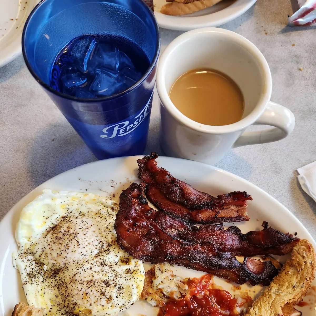 Eggs Overeasy Bacon and Rye Toast with Grape Jelly