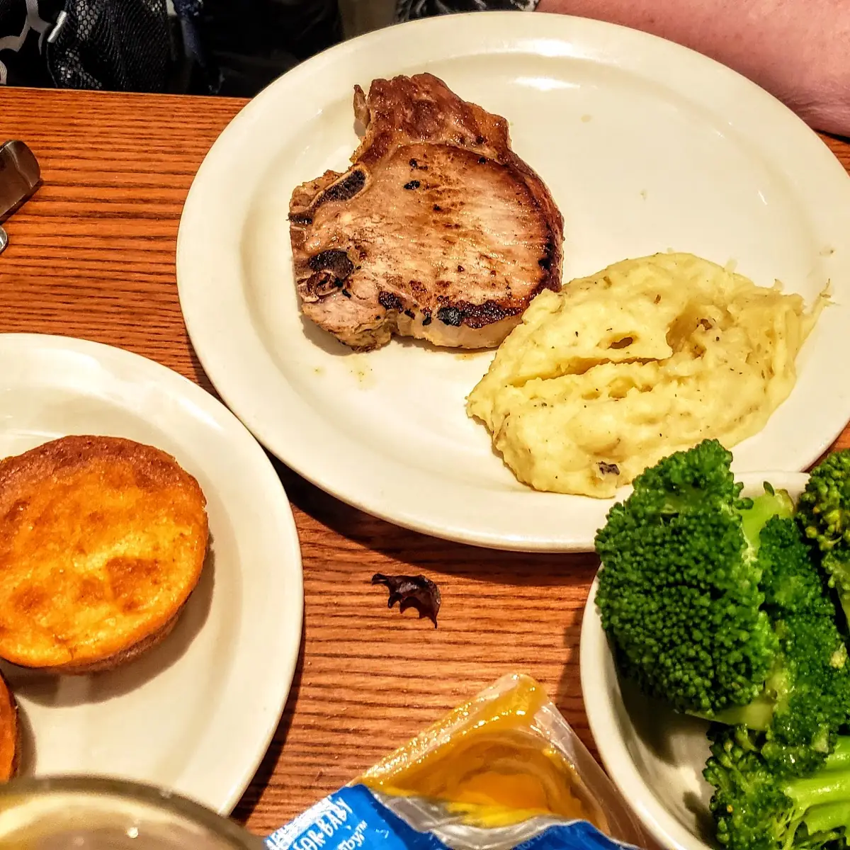 Grilled Pork Chop Mashed Potatoes Broccoli and Corn Bread