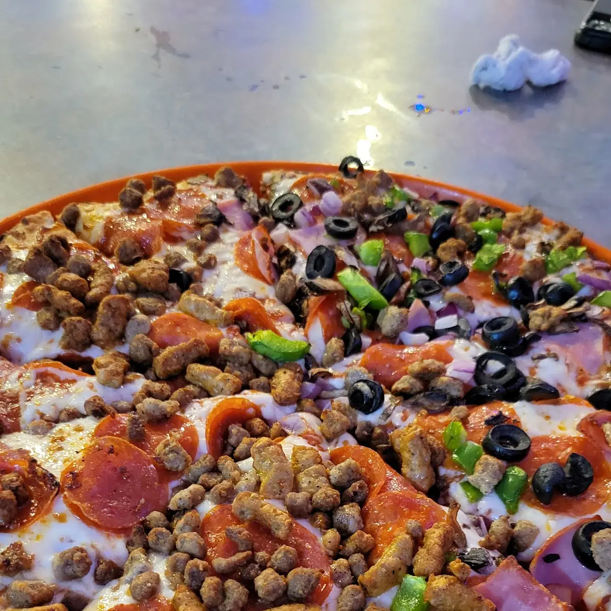 Half Meat Lovers Pizza Half Supreme Pizza