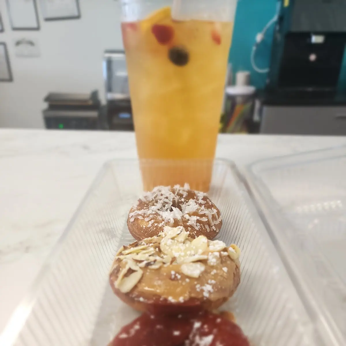 Assorted Donuts w Pineapple Push Energy Tea