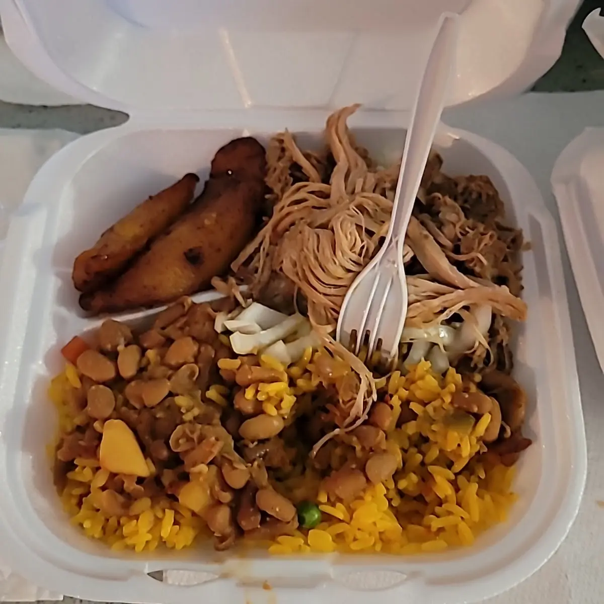 Lechon Asada with Yellow Rice and Pinto Beans
