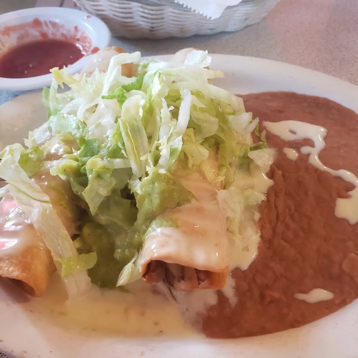 Enchilada and Mole Plate with Rice and Beans