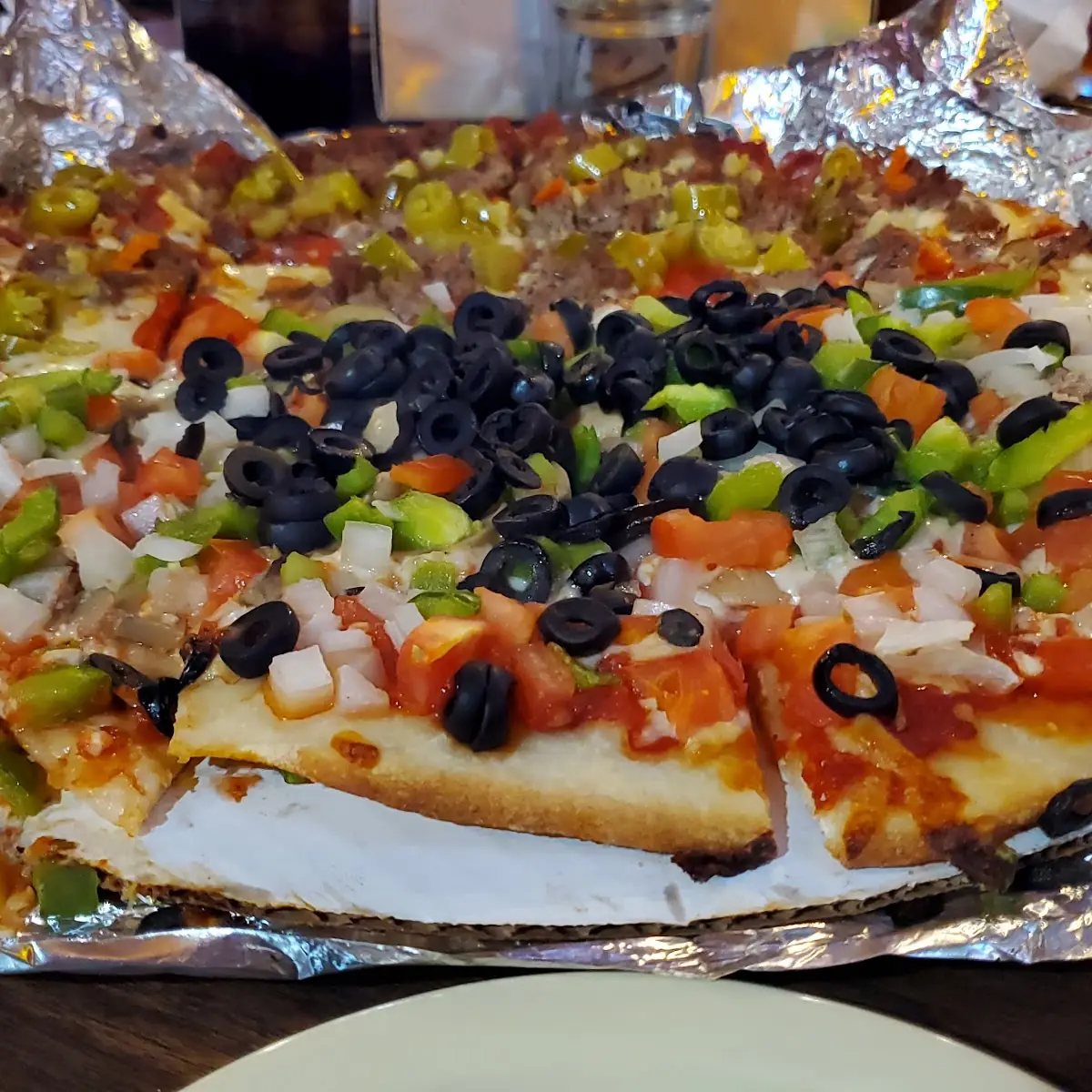 Half Veggie Half Deluxe Pizza