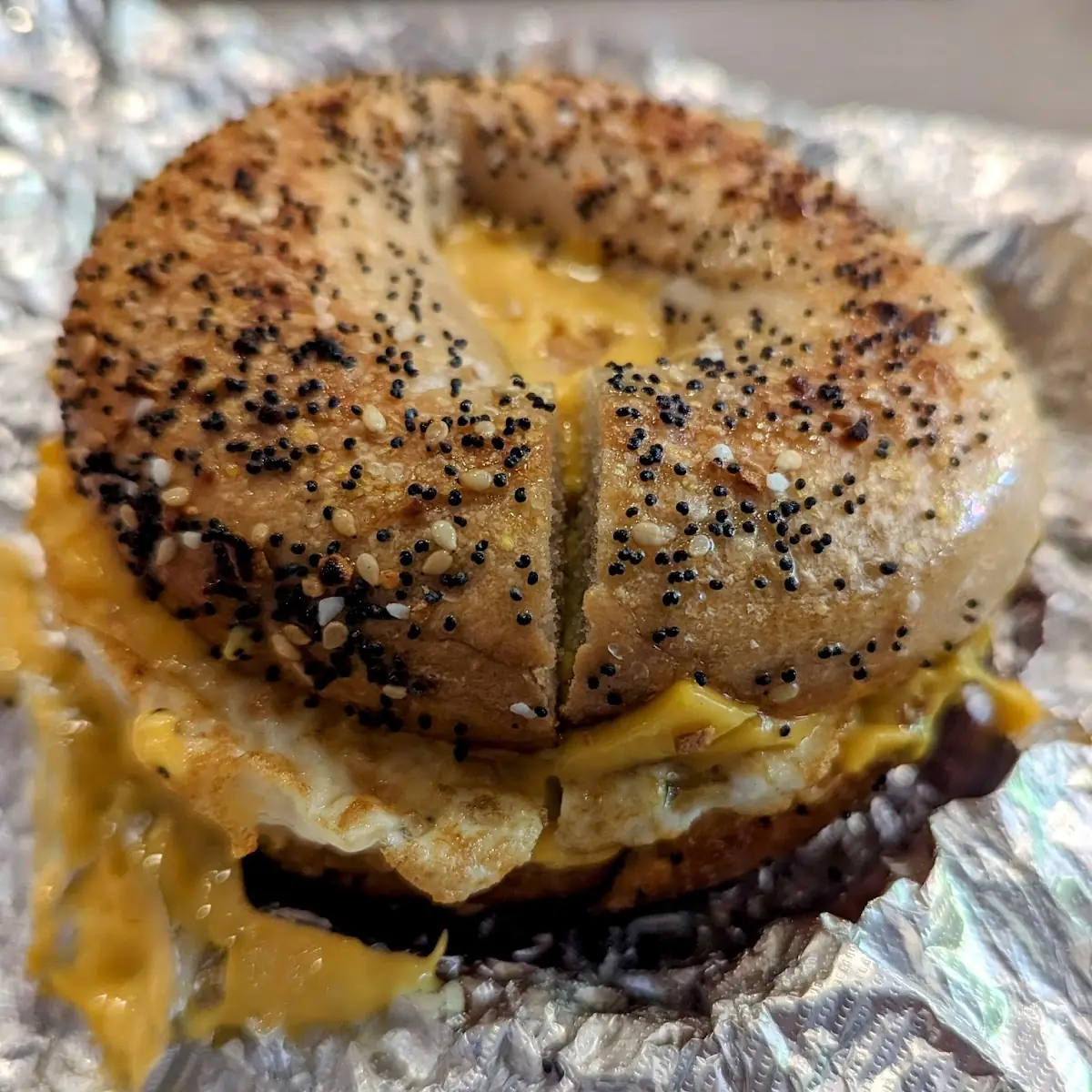 Egg and Sausage on Wheat Everything Bagel