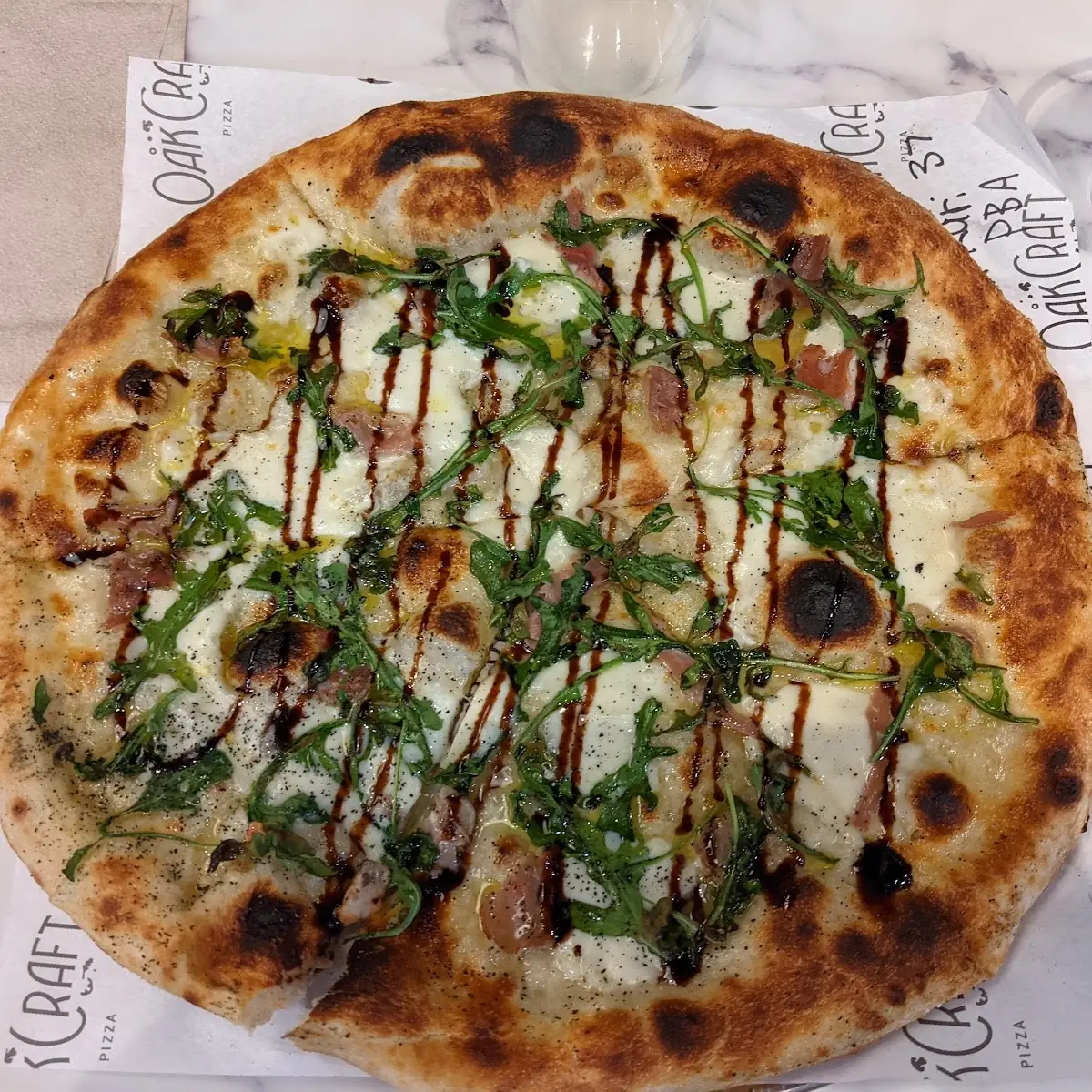 Procuitto and Arugula Pizza