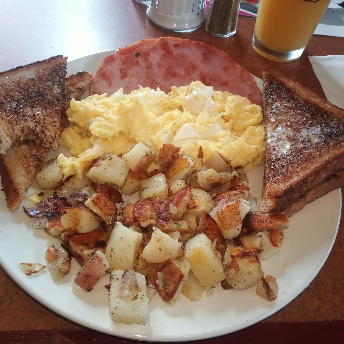 3 Eggs Scrambled with Ham Homfries and Wear Toast