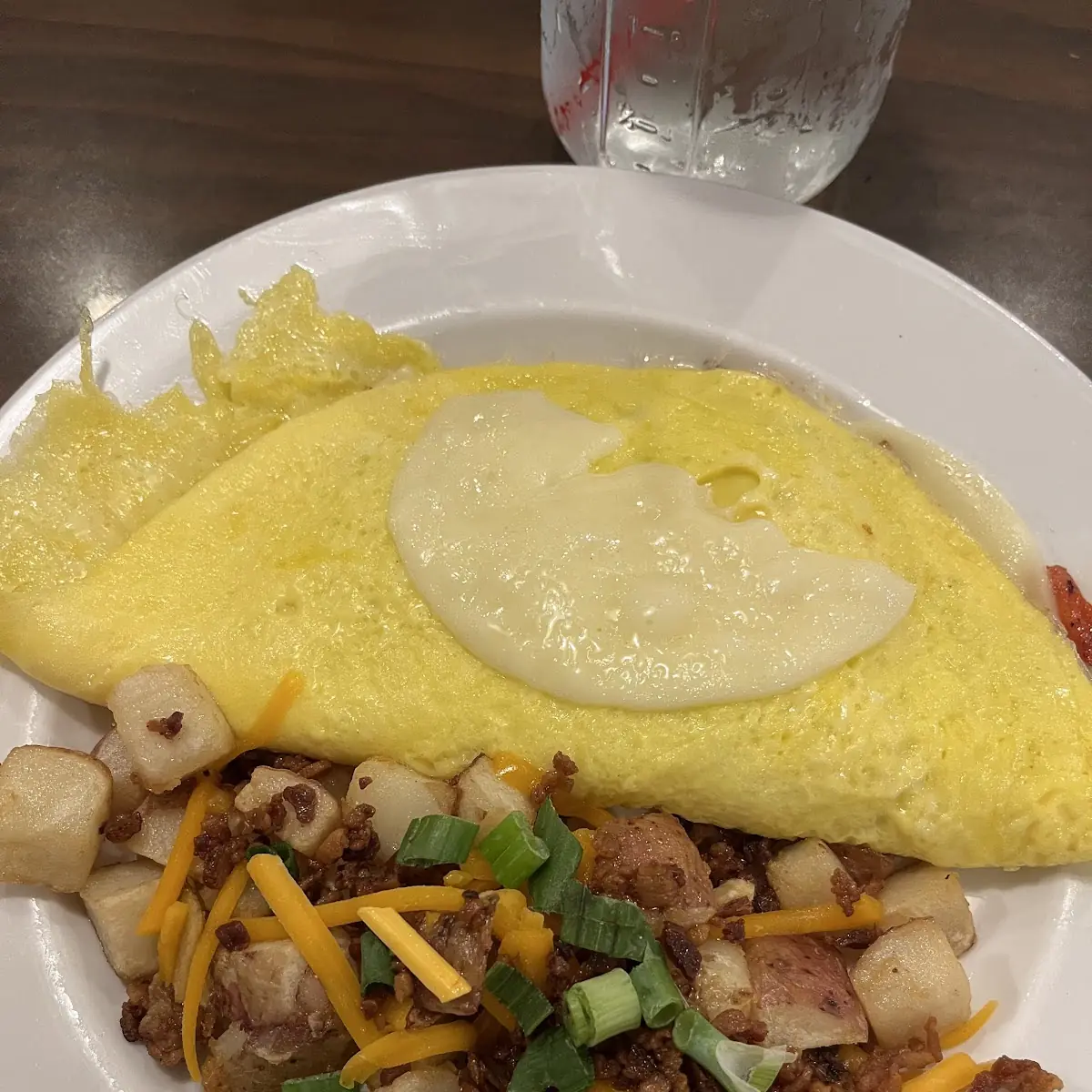Veggie Omelette and Loaded Hashbrowns Requested Light Cheese
