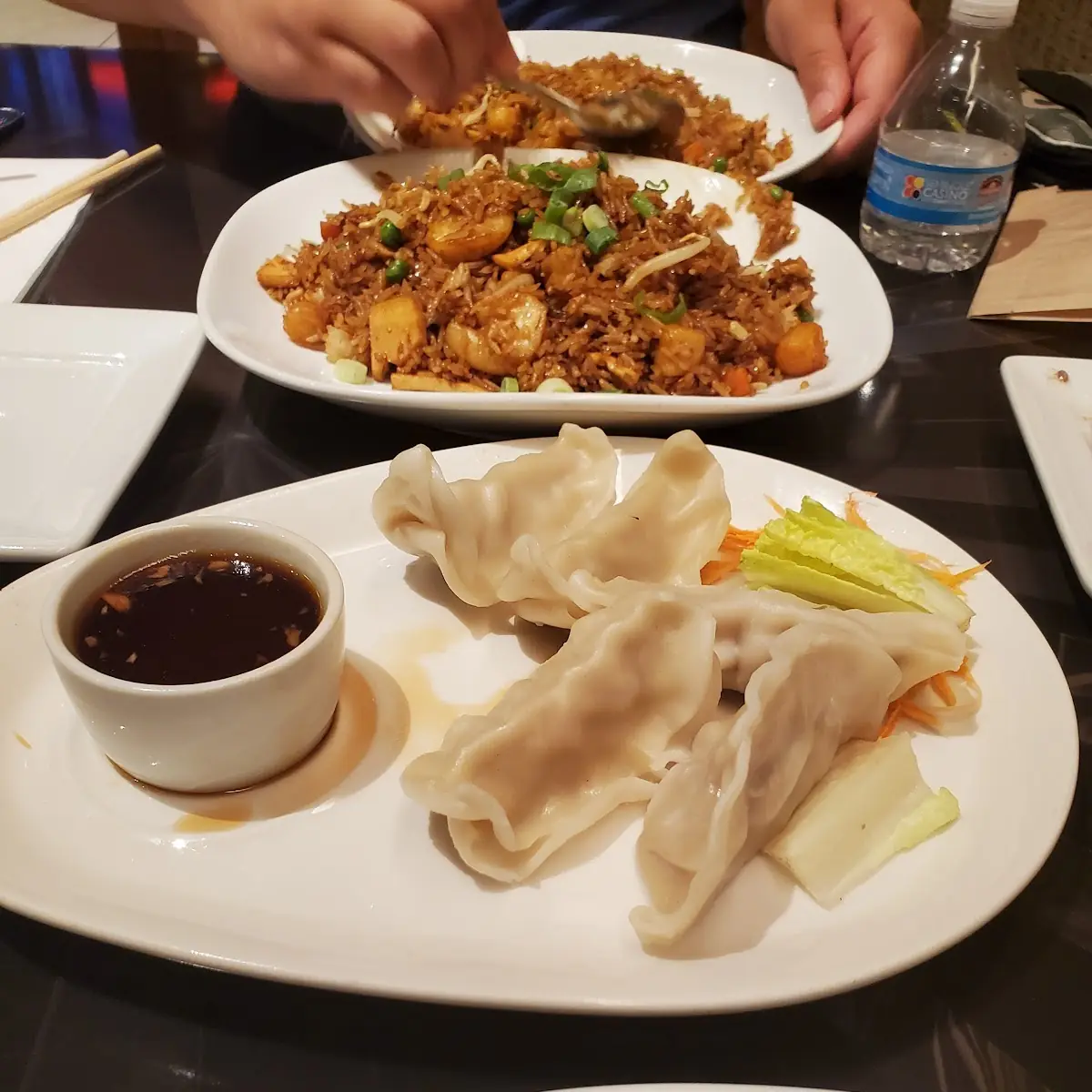 Steamed Dumplings and Seafood Delight Fried Rice