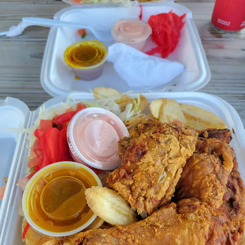 Chuletas Fritas con Tajadas, Ensalada Pico de Gallo, Encurtido y Aderezos / Fried Pork Chops with Plantain Slices, Pico de Gallo Salad, Pickles, and Dressing