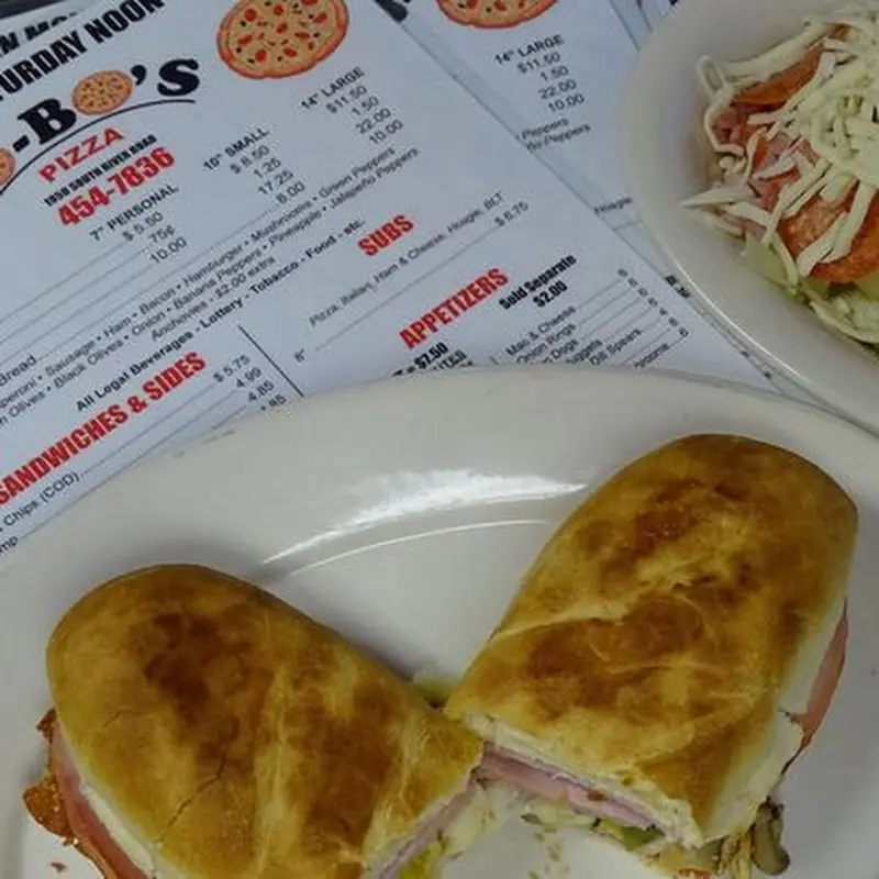 14" Cheese Pizza  Each additional Meat topping $1.50 other 0.75