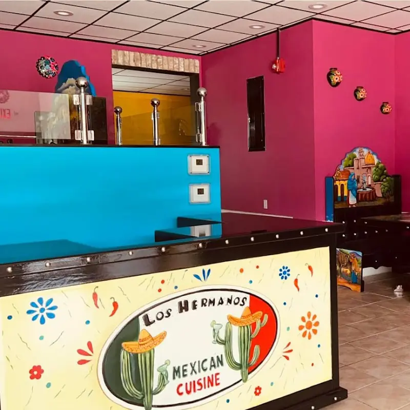 25. One Chicken Enchilada, One Cheese Enchilada, One Beef Taco, Rice and Beans