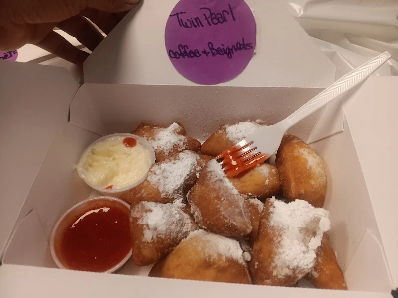 Twin pearl coffee and beignets