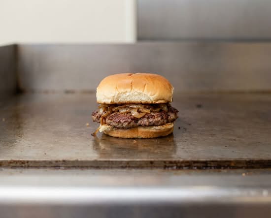 Cozy Burger- All cooked with onions & we don't have cheese