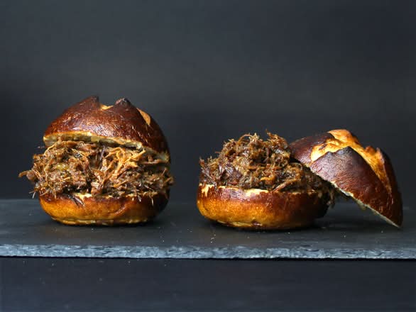 SHREDDED BRISKET ON PRETZEL BUN SLIDERS.
